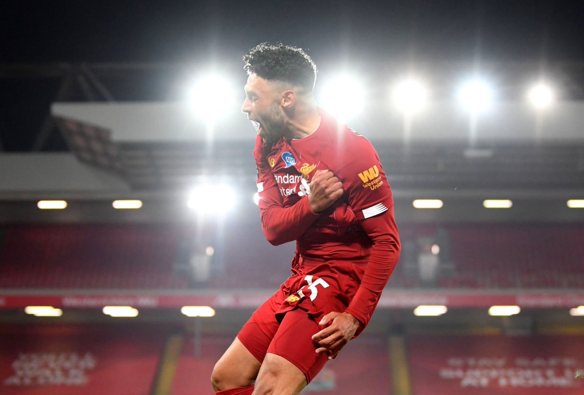 LIVERPOOL, ENGLAND - JULY 22: Alex Oxlade-Chamberlain of Liverpool celebrates after scoring his team's fifth goal during the Premier League match between Liverpool FC and Chelsea FC at Anfield on July 22, 2020 in Liverpool, England.