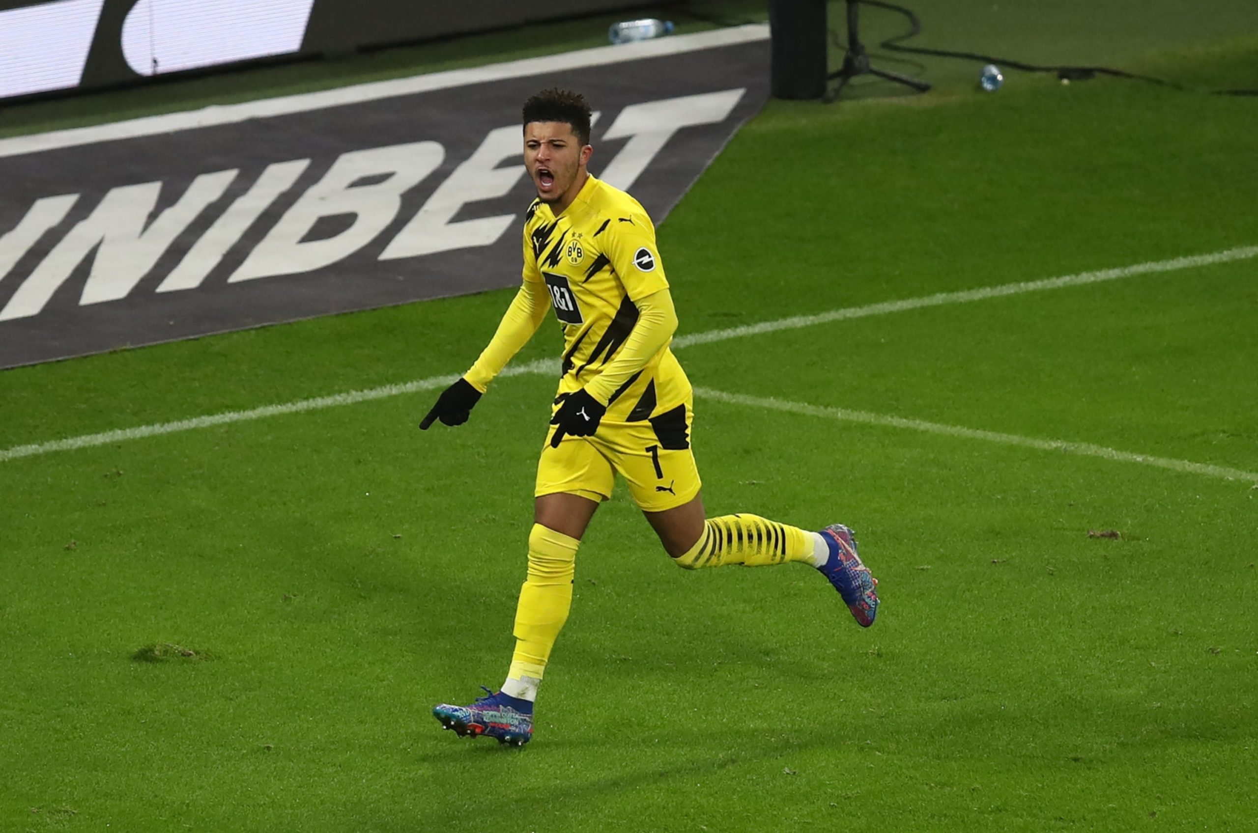 LEIPZIG, GERMANY - JANUARY 09: Jadon Sancho of Borussia Dortmund celebrates after scoring their team's first goal during the Bundesliga match between RB Leipzig and Borussia Dortmund at Red Bull Arena on January 09, 2021 in Leipzig, Germany.