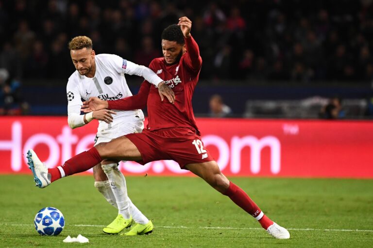 Paris Saint-Germain's Brazilian forward Neymar (L) vies for the ball with Liverpool's English defender Joe Gomez (R) during the UEFA Champions League Group C football match between Paris Saint-Germain (PSG) and Liverpool FC at the Parc des Princes stadium, in Paris, on November 28, 2018.