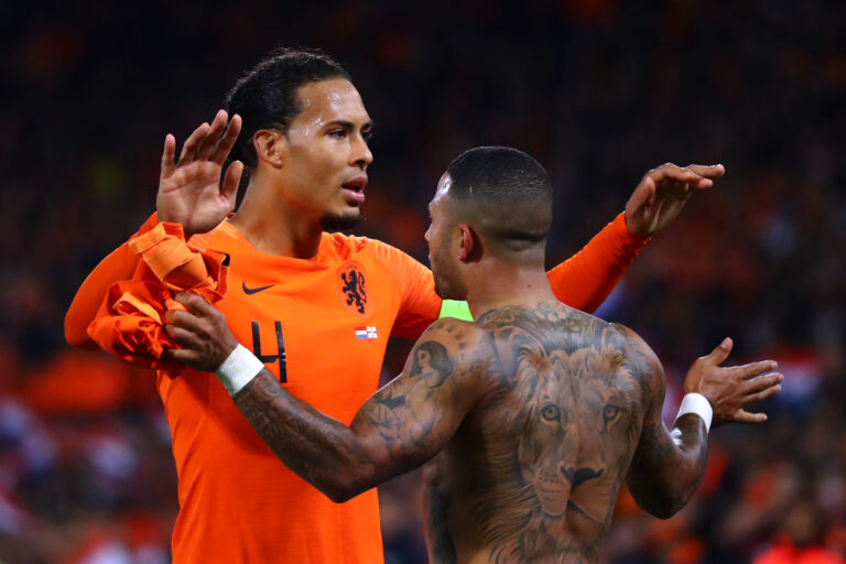ROTTERDAM, NETHERLANDS - OCTOBER 10: Memphis Depay (R) of Netherlands celebrates scoring his teams third goal of the game with Virgil van Dijk during the UEFA Euro 2020 qualifier between Netherlands and Northern Ireland on October 10, 2019 in Rotterdam, Netherlands.