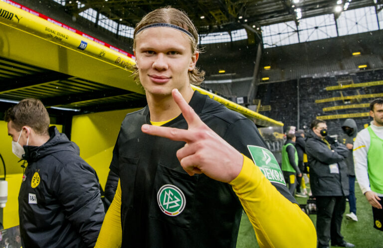 DORTMUND, GERMANY - MAY 22: Erling Haaland of Borussia Dortmund with the jersey of head referee Manuel Gräfe after his final whistle during the Bundesliga match between Borussia Dortmund and Bayer 04 Leverkusen at the Signal Iduna Park on May 22, 2021 in Dortmund, Germany.