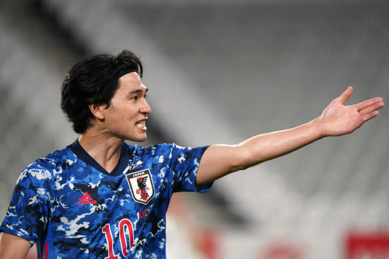 KOBE, JAPAN - JUNE 11: Takumi Minamino of Japan gestures during the international friendly match between Japan and Serbia at Noevir Stadium Kobe on June 11, 2021 in Kobe, Hyogo, Japan.