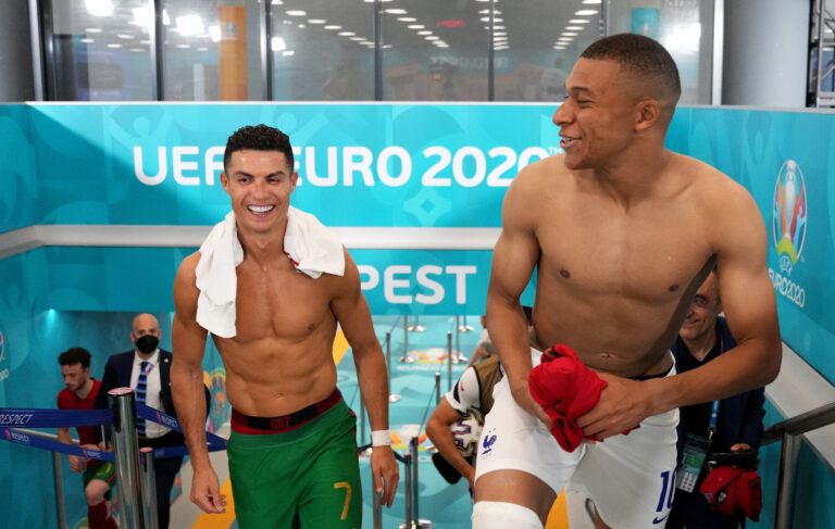 BUDAPEST, HUNGARY - JUNE 23: Cristiano Ronaldo of Portugal speaks with Kylian Mbappe of France in the tunnel following the UEFA Euro 2020 Championship Group F match between Portugal and France at Puskas Arena on June 23, 2021 in Budapest, Hungary.