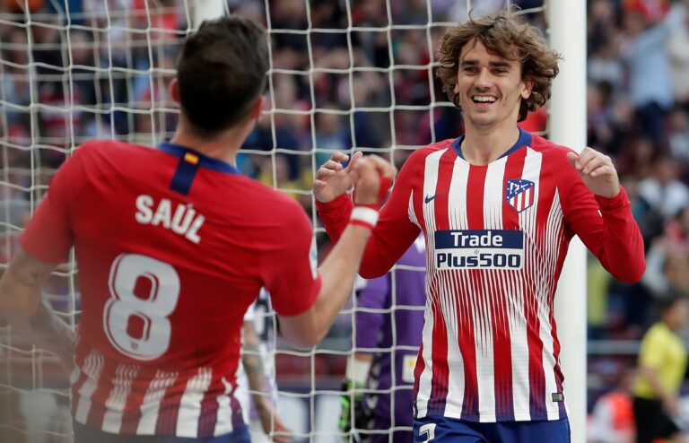 MADRID, SPAIN - APRIL 27: Antoine Griezmann (R) and Saul Niguez (L) of Atletico Madrid celebrate after Joaquin Fernandez (not seen) of Valladolid scored an own goal during the La Liga soccer match between Atletico Madrid and Valladolid at the Wanda Metropolitano Stadium in Madrid, Spain on April 27, 2019.