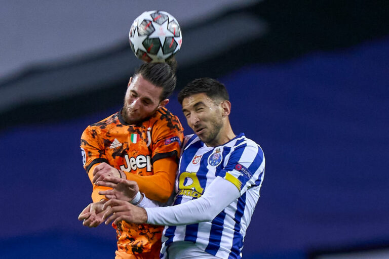 PORTO, PORTUGAL - FEBRUARY 17: Adrien Rabiot of Juventus competes for the ball with Marko Grujic of FC Porto during the UEFA Champions League Round of 16 match between FC Porto and Juventus at Estadio do Dragao on February 17, 2021 in Porto, Portugal. Sporting stadiums around Portugal remain under strict restrictions due to the Coronavirus Pandemic as Government social distancing laws prohibit fans inside venues resulting in games being played behind closed doors. (Photo by Jose Manuel Alvarez/Quality Sport Images/Getty Images)