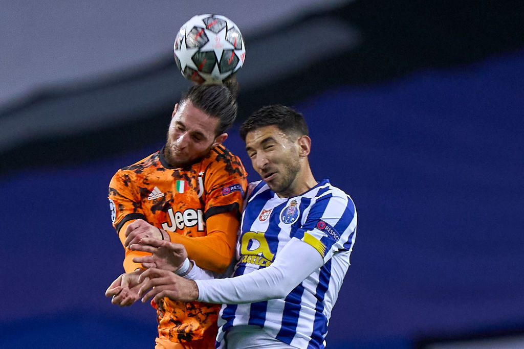 PORTO, PORTUGAL - FEBRUARY 17: Adrien Rabiot of Juventus competes for the ball with Marko Grujic of FC Porto during the UEFA Champions League Round of 16 match between FC Porto and Juventus at Estadio do Dragao on February 17, 2021 in Porto, Portugal. Sporting stadiums around Portugal remain under strict restrictions due to the Coronavirus Pandemic as Government social distancing laws prohibit fans inside venues resulting in games being played behind closed doors. (Photo by Jose Manuel Alvarez/Quality Sport Images/Getty Images)