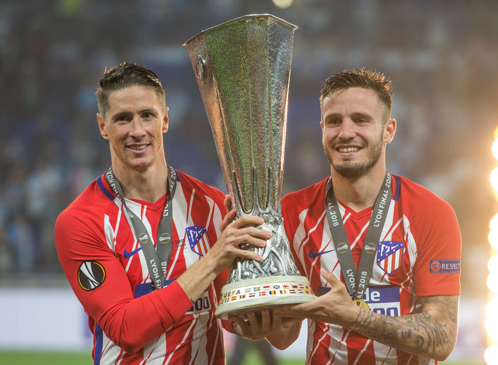 LYON, FRANCE - MAY 16: Fernando Torres and Saúl Ñíguez pose with trophy after Atletico Madrid win the UEFA Europa League Final between Olympique de Marseille and Club Atletico de Madrid at Stade de Lyon on May 16, 2018 in Lyon, France. (Photo by Visionhaus/Corbis via Getty Images)