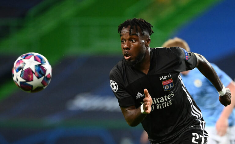 Lyon's Ivorian forward Maxwel Cornet eyes on the ball during the UEFA Champions League quarter-final football match between Manchester City and Lyon at the Jose Alvalade stadium in Lisbon on August 15, 2020. (Photo by FRANCK FIFE / POOL / AFP) (Photo by FRANCK FIFE/POOL/AFP via Getty Images)