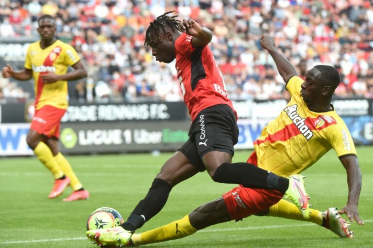 Rennes' Belgian forward Jeremy Doku (L) is tackled by Lens' Ivorian midfielder Seko Fofana during the French L1 football match between Stade Rennais (Rennes) and RC Lens at The Roazhon Park Stadium in Rennes, northern France on August 8, 2021. (Photo by JEAN-FRANCOIS MONIER / AFP) (Photo by JEAN-FRANCOIS MONIER/AFP via Getty Images)