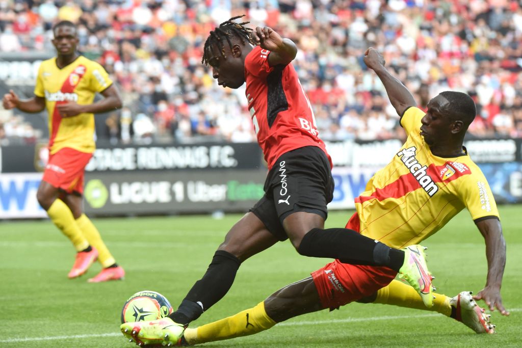Rennes' Belgian forward Jeremy Doku (L) is tackled by Lens' Ivorian midfielder Seko Fofana during the French L1 football match between Stade Rennais (Rennes) and RC Lens at The Roazhon Park Stadium in Rennes, northern France on August 8, 2021. (Photo by JEAN-FRANCOIS MONIER / AFP) (Photo by JEAN-FRANCOIS MONIER/AFP via Getty Images)