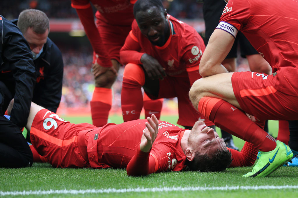 LIVERPOOL, ENGLAND - AUGUST 08: Andrew Robertson of Liverpool reacts with pain after a challenge during the pre-season friendly match between Liverpool and Athletic Club at Anfield on August 8, 2021 in Liverpool, England. (Photo by Simon Stacpoole/Offside/Offside via Getty Images)