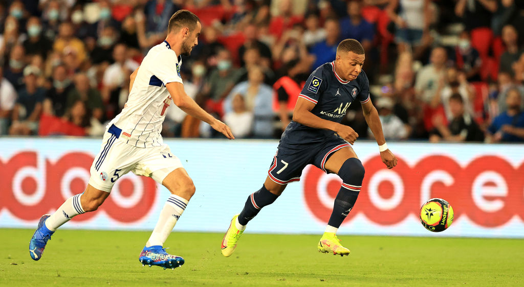 PARIS, FRANCE - AUGUST 14: Kylian Mbappe of Paris Saint- Germain runs with the ball during the Ligue 1 Uber Eats match between Paris Saint Germain and Strasbourg at Parc des Princes on August 14, 2021 in Paris, France. (Photo by David Rogers/Getty Images)