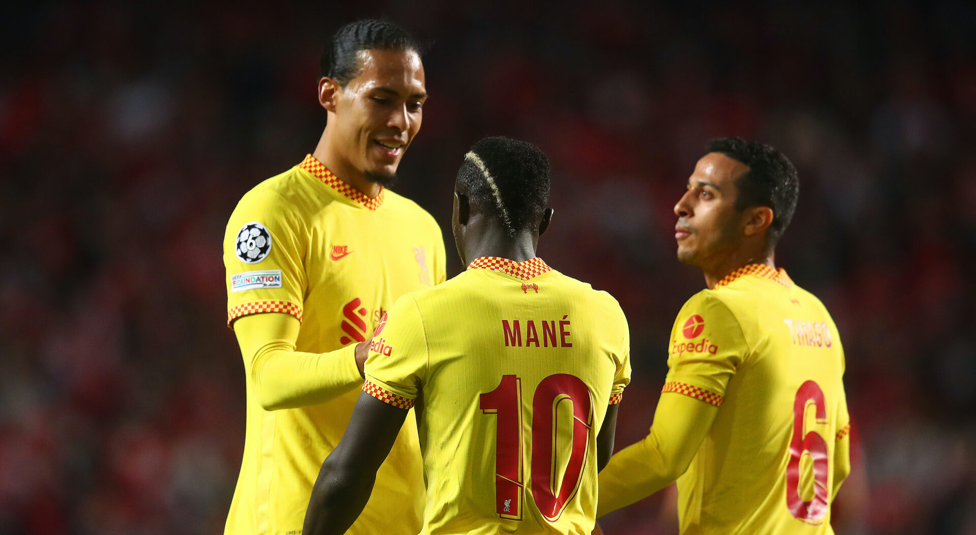 LISBON, PORTUGAL - APRIL 05: Sadio Mane of Liverpool celebrates scoring a goal to make the score 0-2 with team-mates Virgil van Dijk and Thiago Alcantara during the UEFA Champions League Quarter Final Leg One match between SL Benfica and Liverpool FC at Estadio da Luz on April 5, 2022 in Lisbon, Portugal. (Photo by Chris Brunskill/Fantasista/Getty Images)