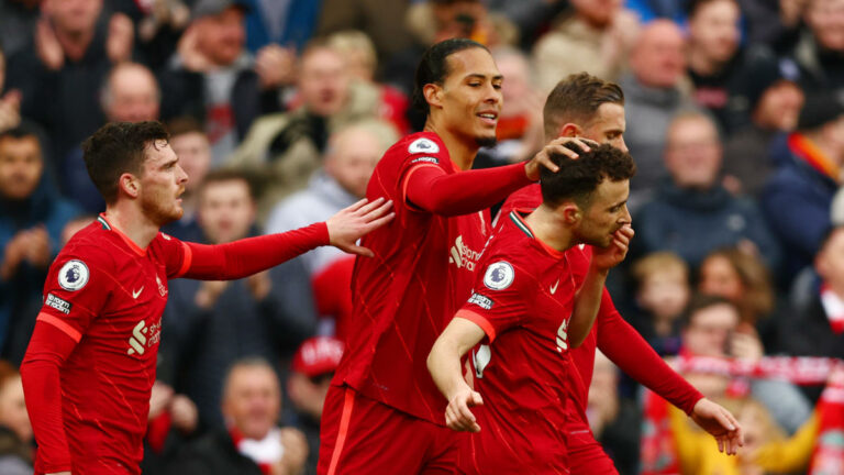 LIVERPOOL, ENGLAND - APRIL 02: Diogo Jota of Liverpool celebrates with teammates (L-R) Andrew Robertson, Virgil van Dijk and Jordan Henderson after scoring their team's first goal during the Premier League match between Liverpool and Watford at Anfield on April 02, 2022 in Liverpool, England. (Photo by Clive Brunskill/Getty Images)