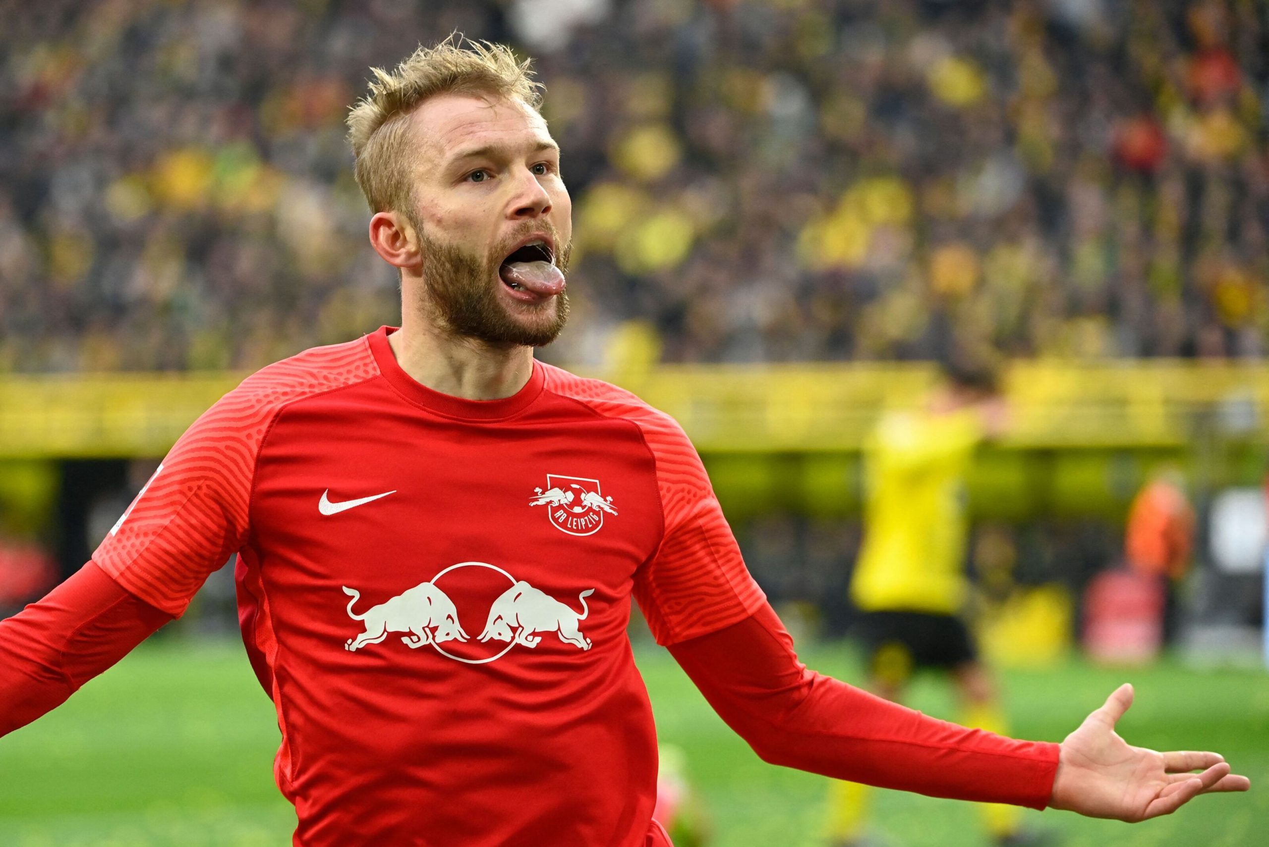 Leipzig's Austrian midfielder Konrad Laimer celebrates scoring the 1-0 goal during the German first division Bundesliga football match Borussia Dortmund v RB Leipzig in Dortmund, western Germany, on April 2, 2022. - DFL REGULATIONS PROHIBIT ANY USE OF PHOTOGRAPHS AS IMAGE SEQUENCES AND/OR QUASI-VIDEO (Photo by Ina Fassbender / AFP) / DFL REGULATIONS PROHIBIT ANY USE OF PHOTOGRAPHS AS IMAGE SEQUENCES AND/OR QUASI-VIDEO (Photo by INA FASSBENDER/AFP via Getty Images)