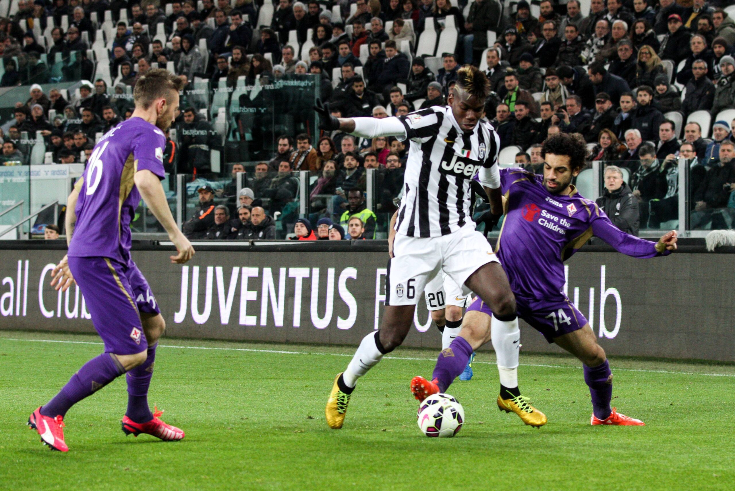March 5 2015 Turin Italy Juventus midfielder Paul Pogba 6 fights for the ball against Fioren