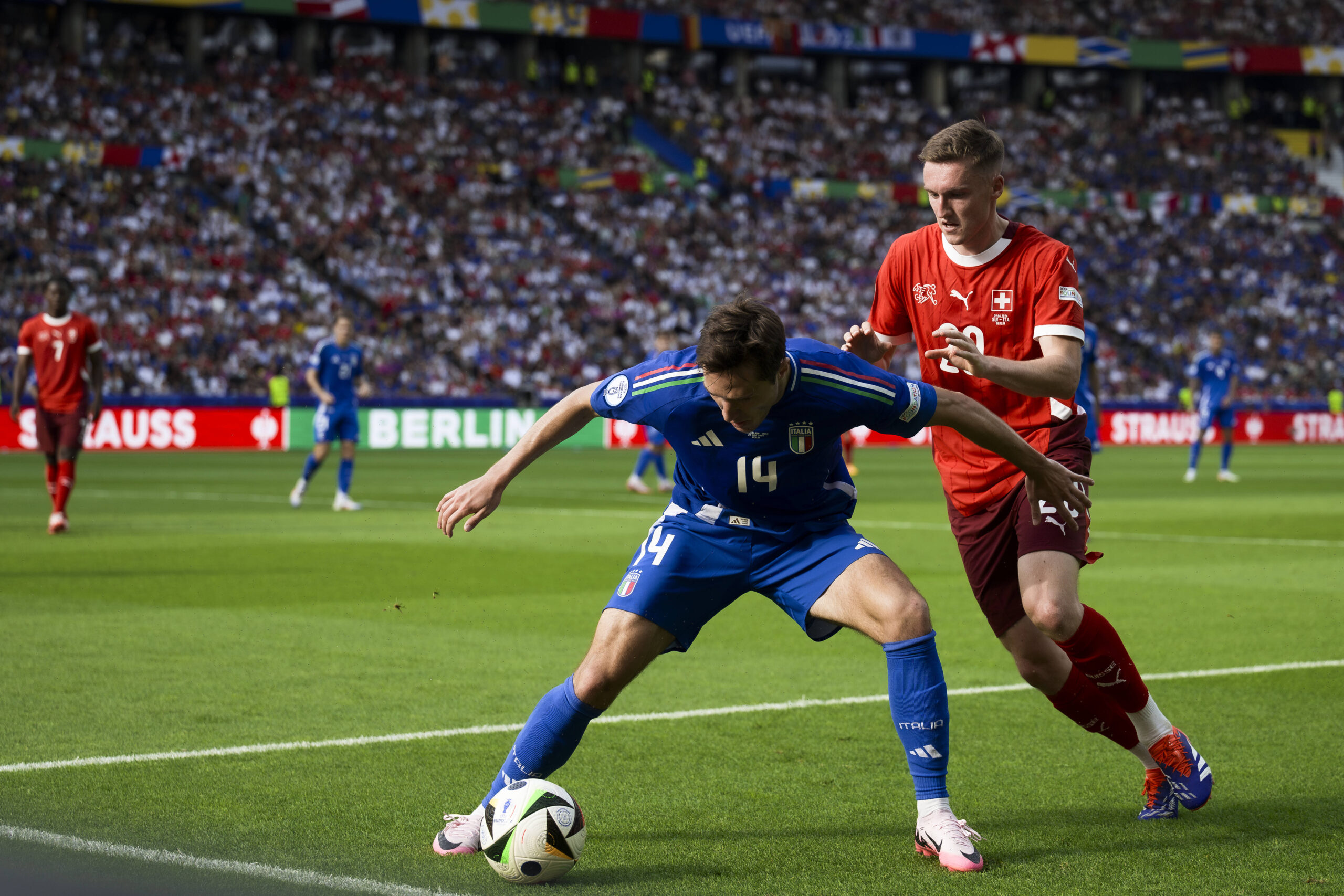 Switzerland v Italy - UEFA EURO, EM, Europameisterschaft,Fussball 2024 Federico Chiesa of Italy competes for the ball wi