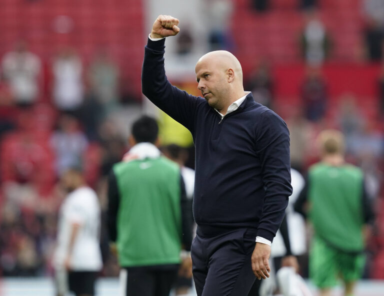 Manchester, England, 1st September 2024. Arne Slot manager of Liverpool waves to fans at the final whistle during the Pr