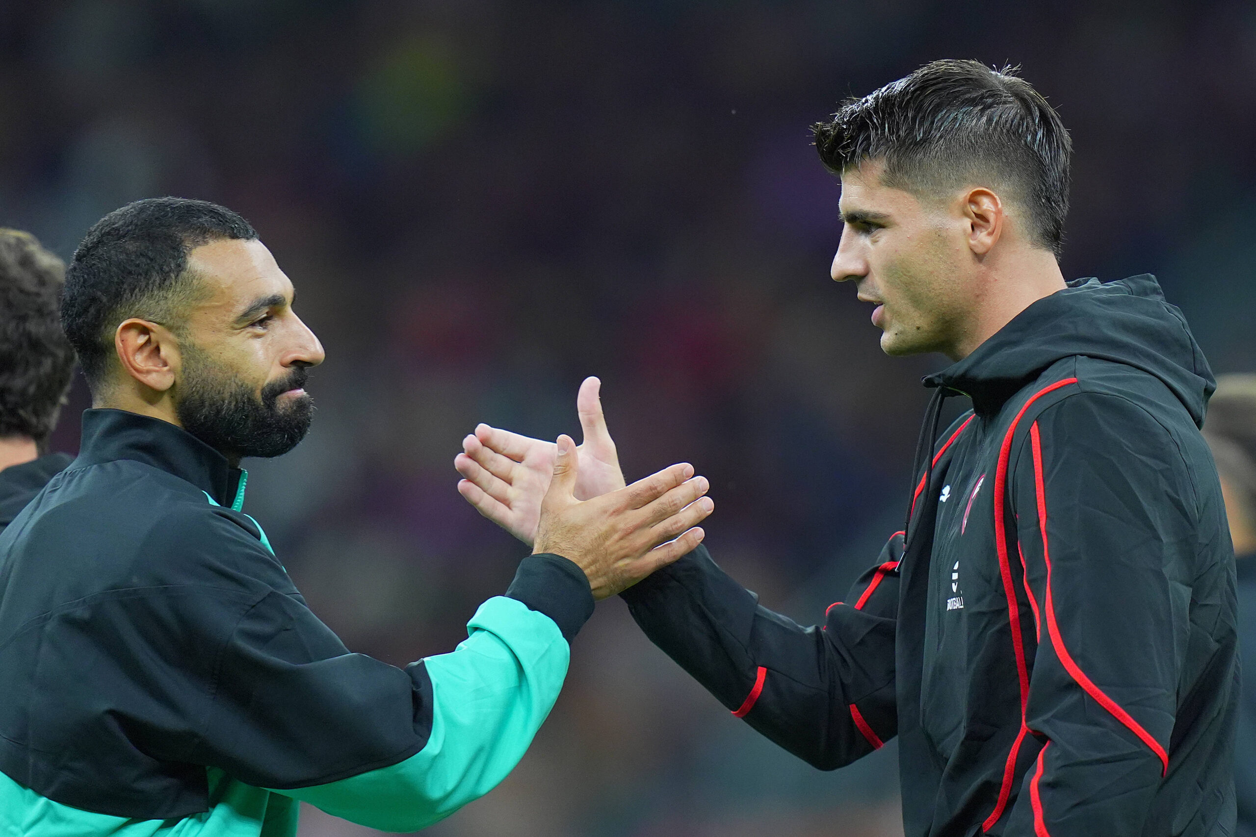 AC Milans Alvaro Morata and Liverpool s Mohamed Salah before the Uefa Champions League soccer match between Milan and L