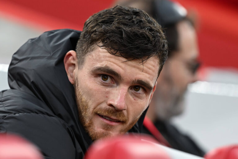 Premier League Liverpool v Brighton and Hove Albion Andrew Robertson of Liverpool sits on the bench ahead of the Premier