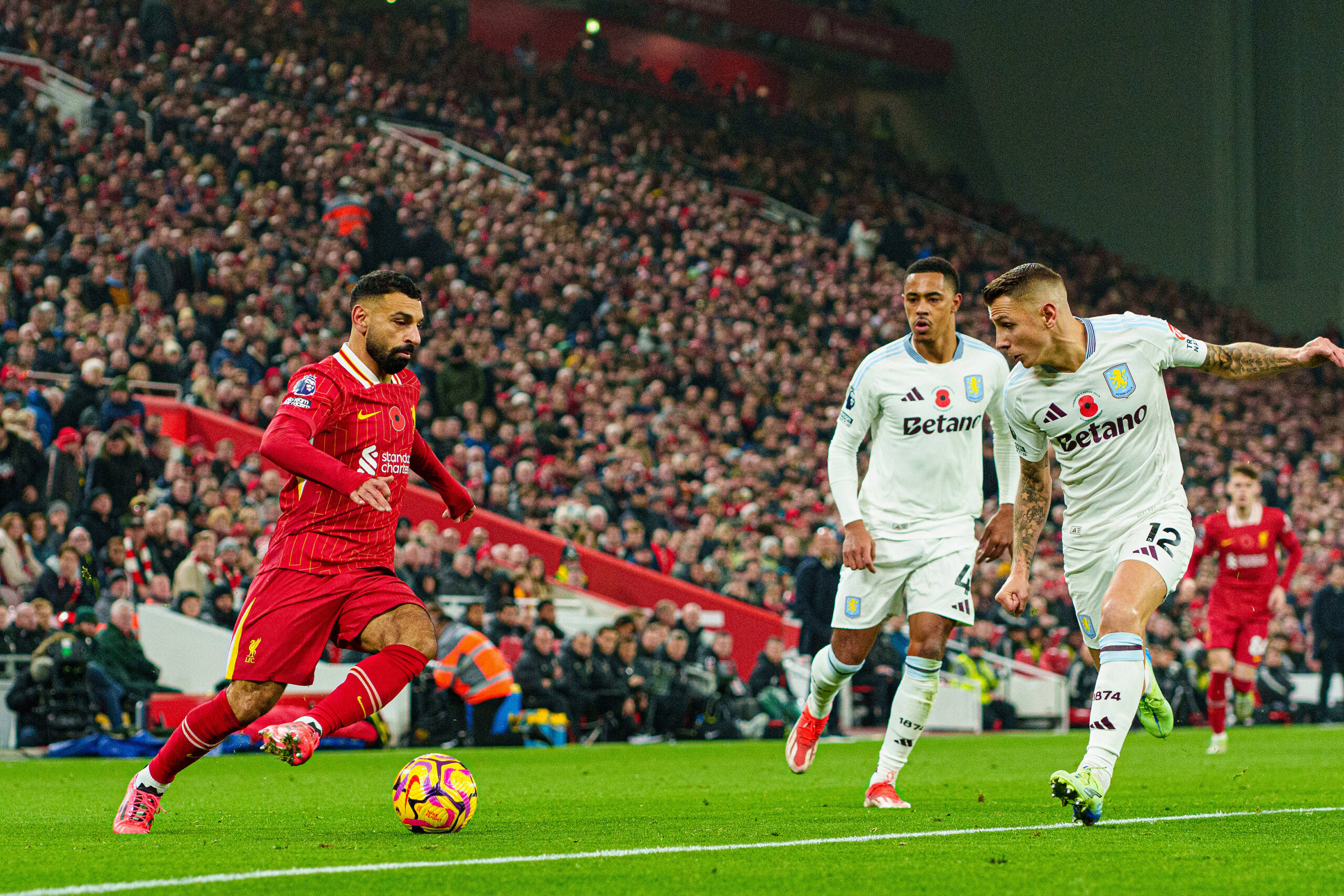 Liverpool FC v Aston Villa FC - Premier League Liverpool s Mohamed Salah competes with Aston Villa s Jacob Ramsey and Lu