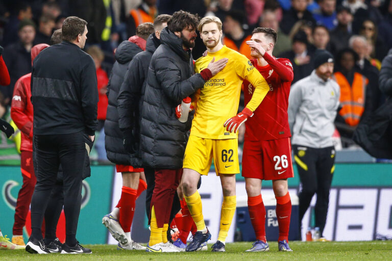 Alisson Becker of Liverpool speaks to Caoimhin Kelleher of Liverpool before penalties during the Carabao Cup Final match
