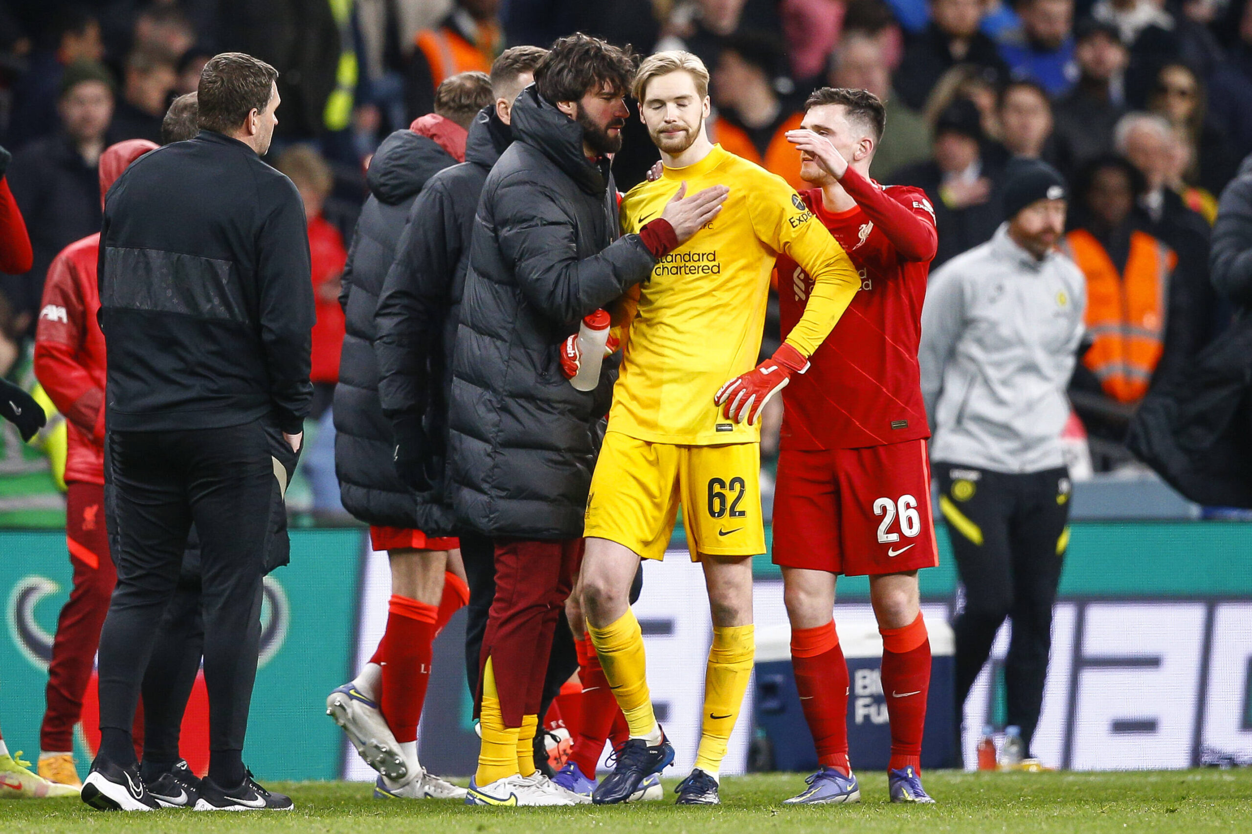 Alisson Becker of Liverpool speaks to Caoimhin Kelleher of Liverpool before penalties during the Carabao Cup Final match