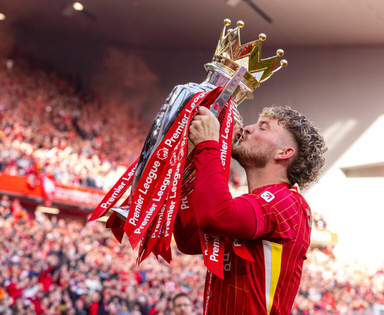 Harvey Elliott celebrating with the Premier League trophy in May 2025